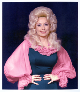 Dolly Parton in pink and blue